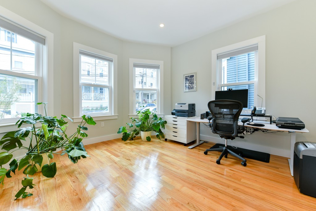 66 Wyman Street, Unit 1 Boston, MA 02130 - Photo 26 of 34 a view of a workspace with furniture and a window