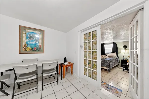 a bedroom with furniture and a window