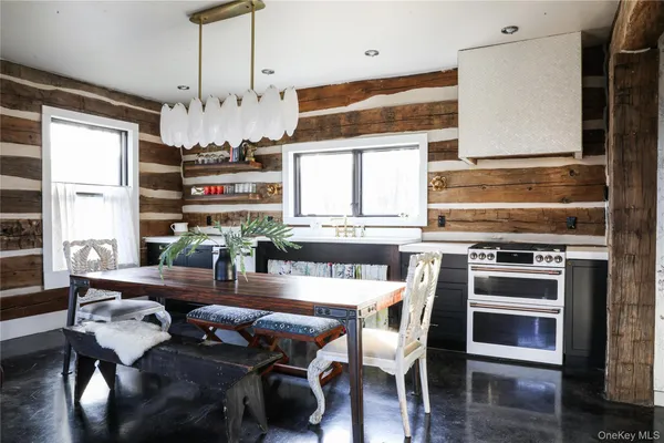 a kitchen with stainless steel appliances granite countertop a stove and a sink