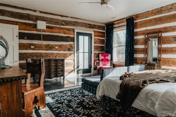 a view of a room with wooden floor and windows