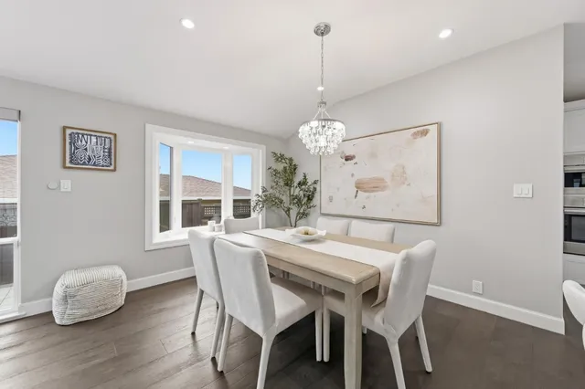 a spacious bedroom with a bed a couch and dresser