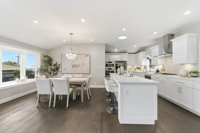 a bedroom with a bed and a potted plant