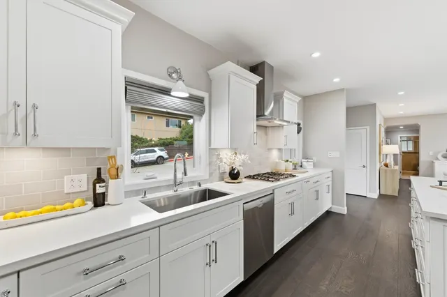 a living room with furniture a rug and a table