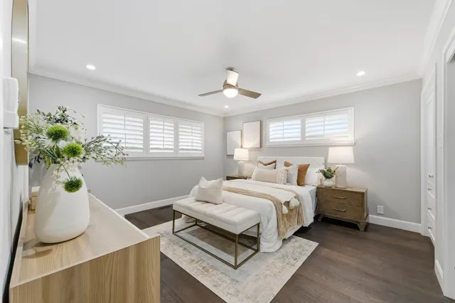 a bedroom with bed and a window