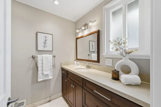 a view of empty room with white walls