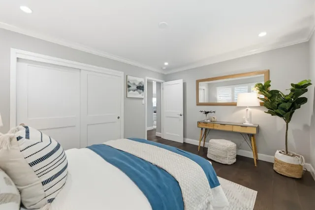 an aerial view of a house with a yard and lake view