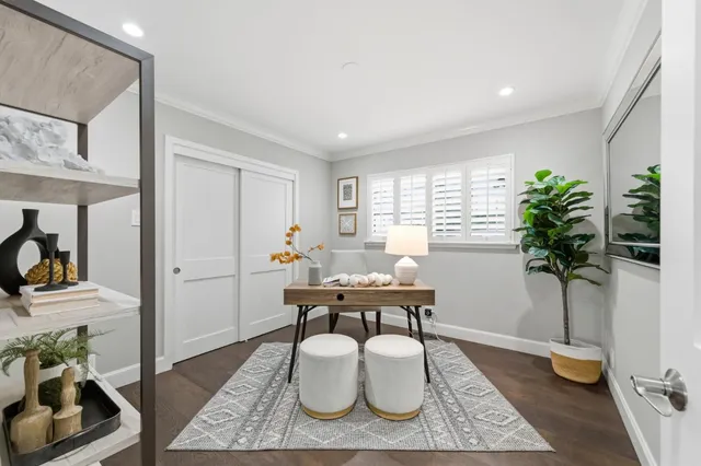 a view of a house with backyard and sitting area