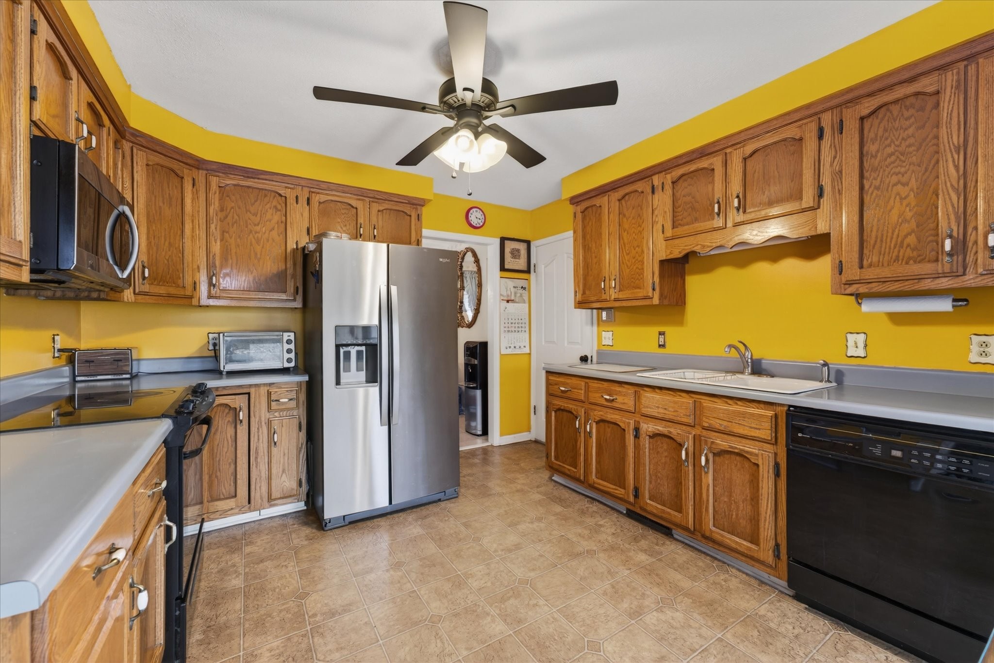 2201 Bearden Road Clarksville, TN 37043 - Photo 11 of 38 a kitchen with stainless steel appliances granite countertop a refrigerator a sink dishwasher stove and cabinets