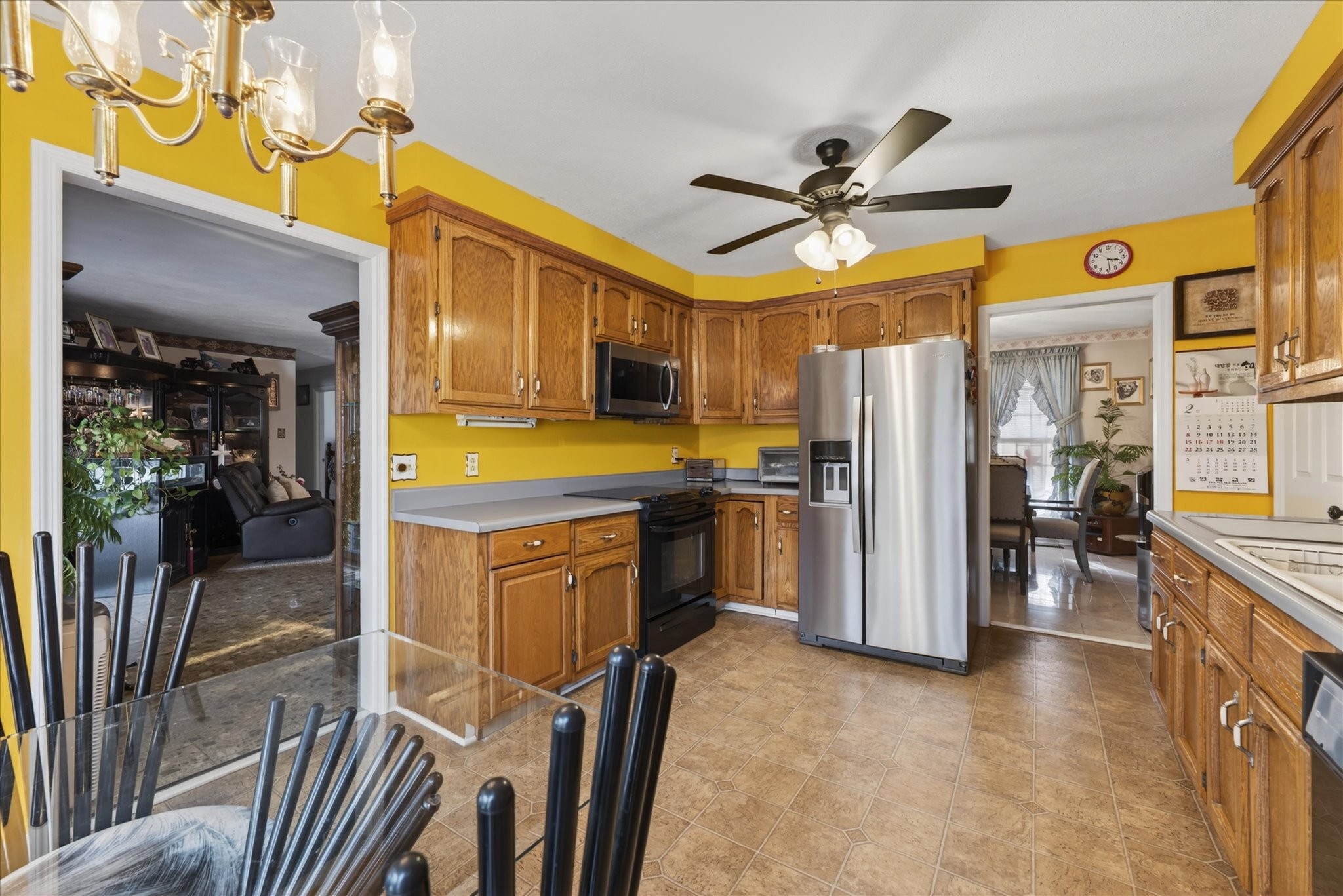 2201 Bearden Road Clarksville, TN 37043 - Photo 12 of 38 a kitchen with stainless steel appliances a refrigerator a stove a sink dishwasher and a dining table with wooden floor