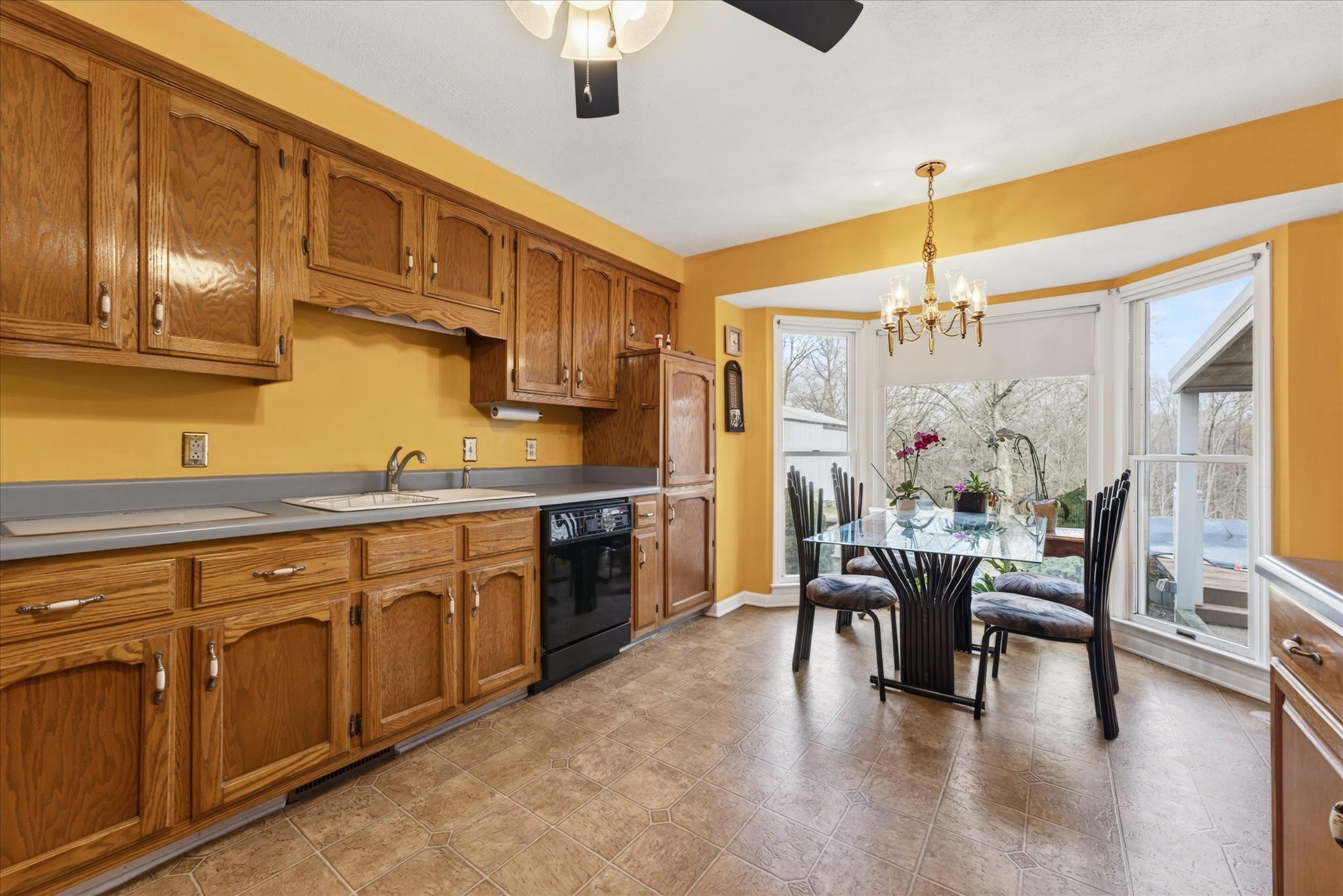 2201 Bearden Road Clarksville, TN 37043 - Photo 13 of 38 a open kitchen with stainless steel appliances granite countertop a stove top oven a dining table and chairs with wooden floor
