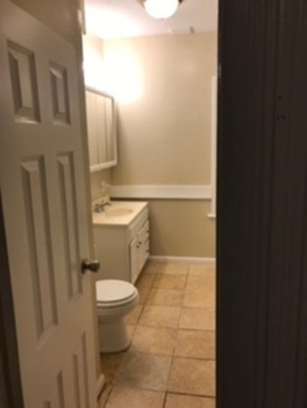 63-65 Tyler Street Springfield, MA 01109 - Photo 8 of 8 a bathroom with a sink a toilet and shower