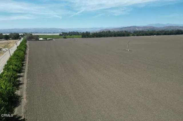 a view of a lake with mountain in the background