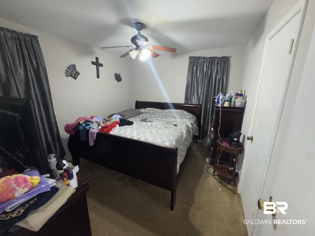 1302 Best Drive Mobile, AL 36608 - Photo 3 of 5 Bedroom featuring a ceiling fan and carpet flooring