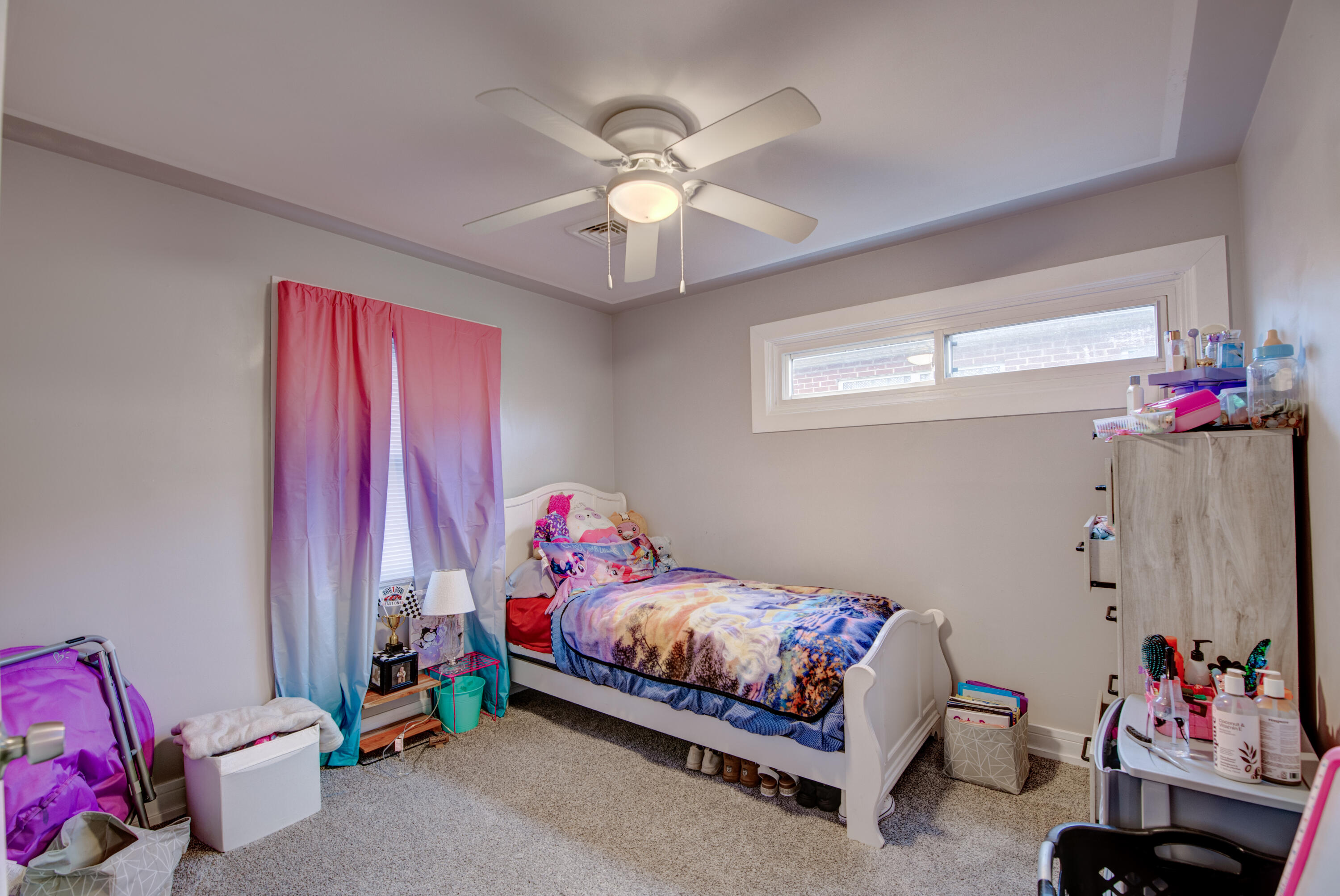 2080 Wright Street Gary, IN 46404 - Photo 13 of 20 a bedroom with a bed and a chandelier