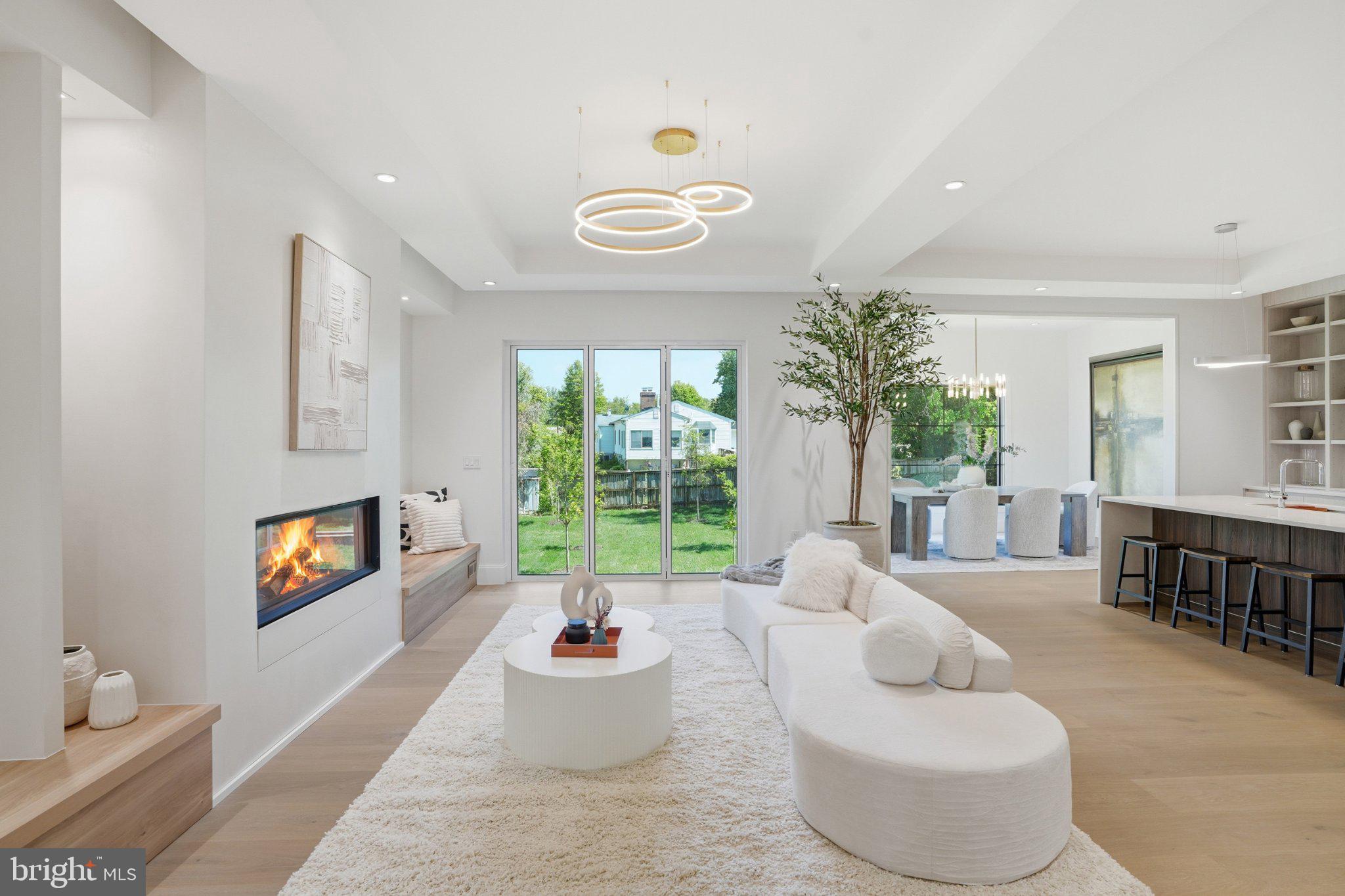 7421 Magarity Road Falls Church, VA 22043 - Photo 12 of 66 Bright, modern living space with greenery.