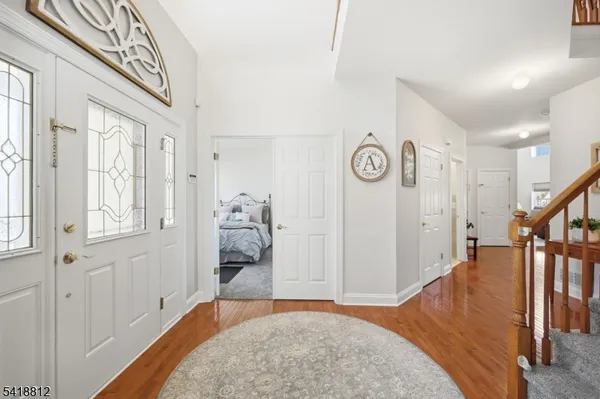 a kitchen with stainless steel appliances granite countertop a kitchen island a stove a table and chairs