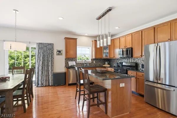 a living room with furniture and stairs