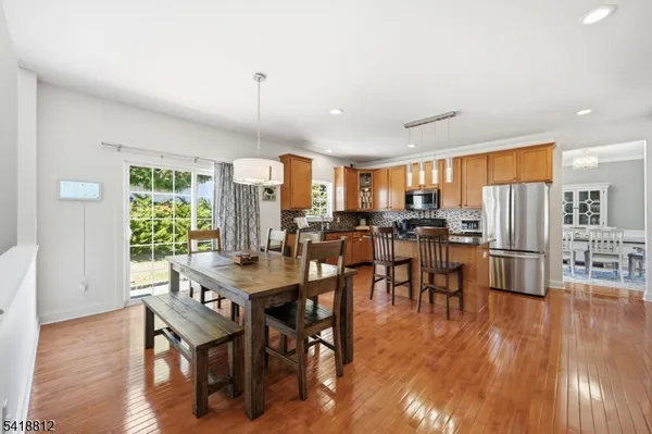 a spacious bedroom with a bed and a table in it