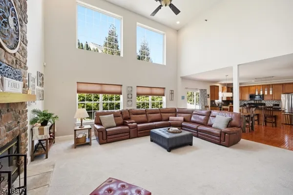 a view of livingroom with furniture and chandelier fan