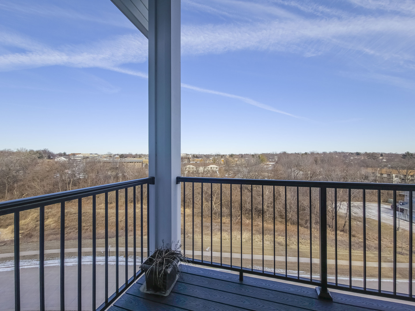 2592 Middle Road, Unit 313 Bettendorf, IA 52722 - Photo 24 of 52 a view of a balcony with wooden floor