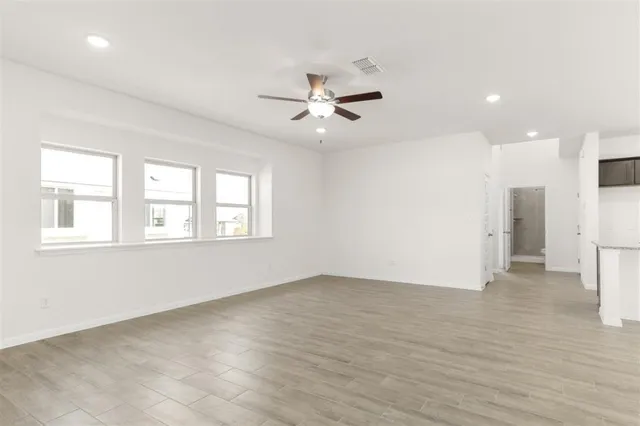 a kitchen with a refrigerator and a sink