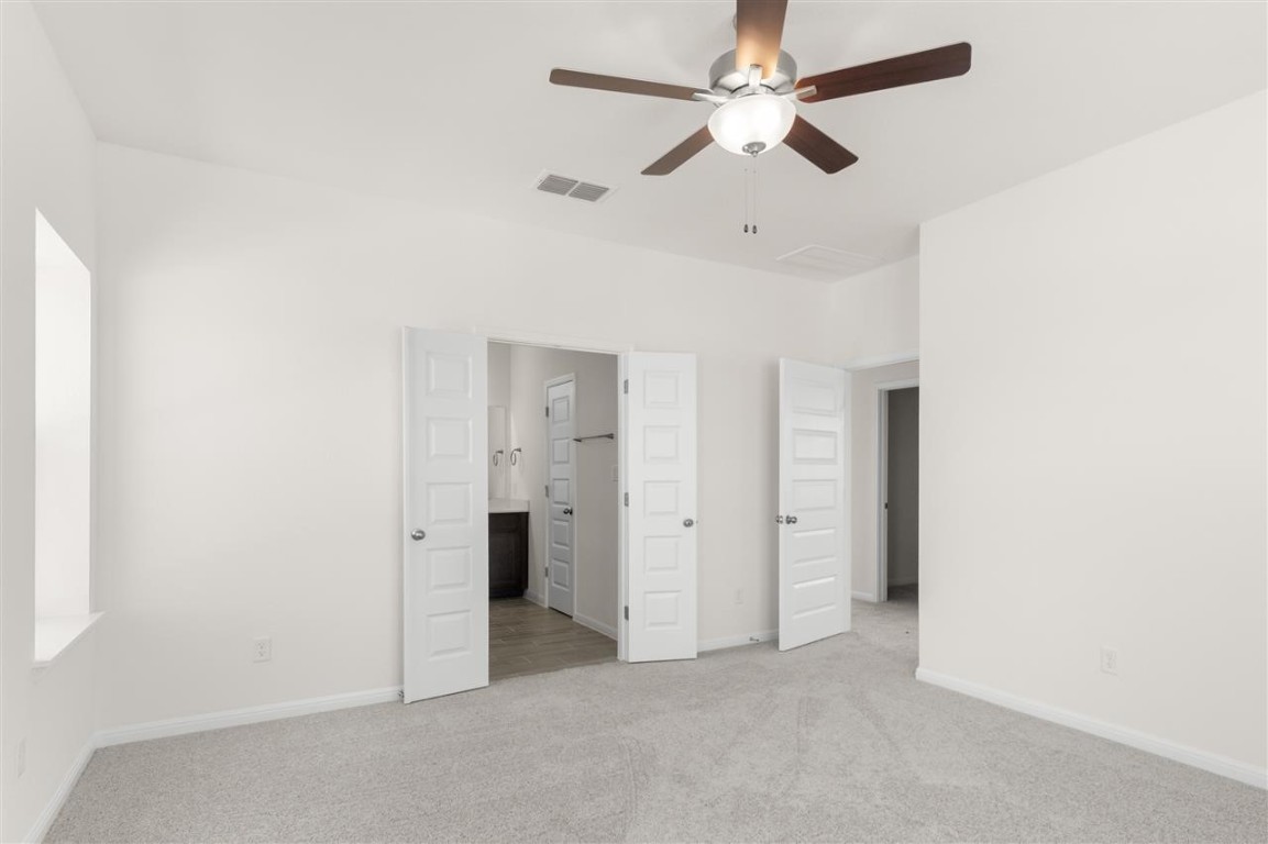 709 Paddock Lane Georgetown, TX 78626 - Photo 24 of 35 an empty room with a ceiling fan and a ceiling fan