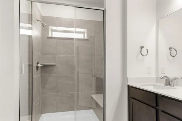 a bathroom with a double vanity sink mirror and