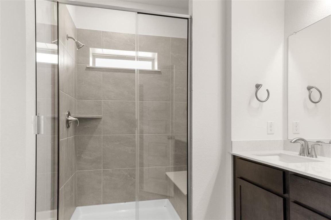 709 Paddock Lane Georgetown, TX 78626 - Photo 26 of 35 a bathroom with a sink and a mirror