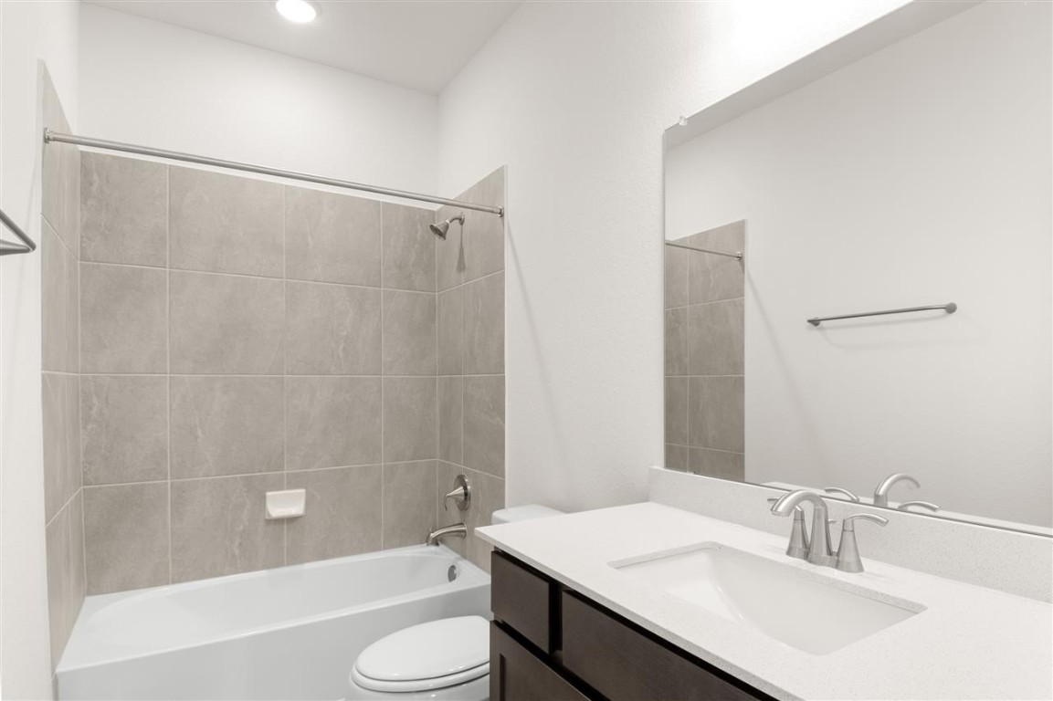 709 Paddock Lane Georgetown, TX 78626 - Photo 28 of 35 a bathroom with a sink and a mirror