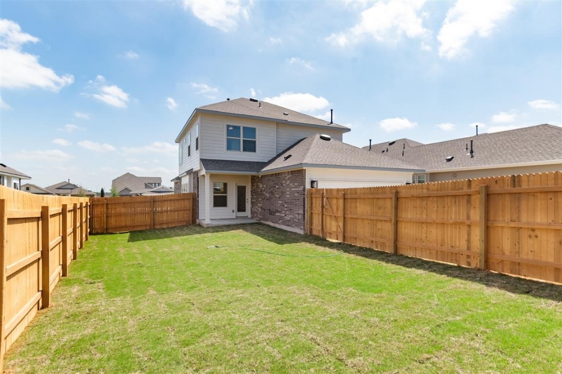 709 Paddock Lane Georgetown, TX 78626 - Photo 32 of 35 a view of a house with a yard and sitting area