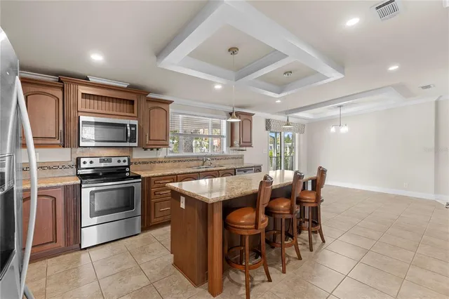an empty room with windows and ceiling fan