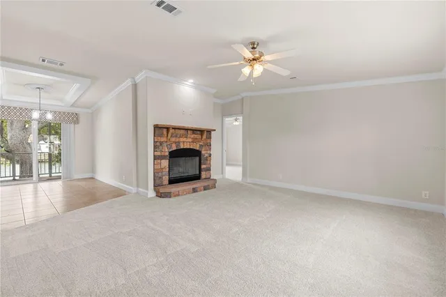 an aerial view of residential houses with outdoor space and lake view