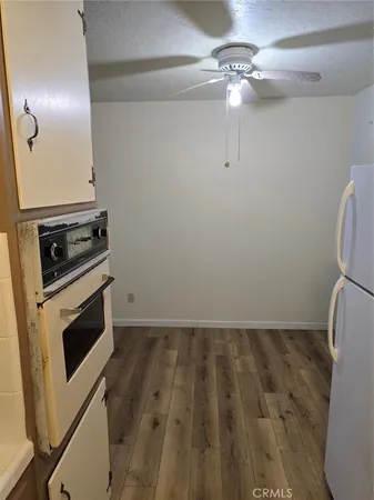 a view of a livingroom with wooden floor
