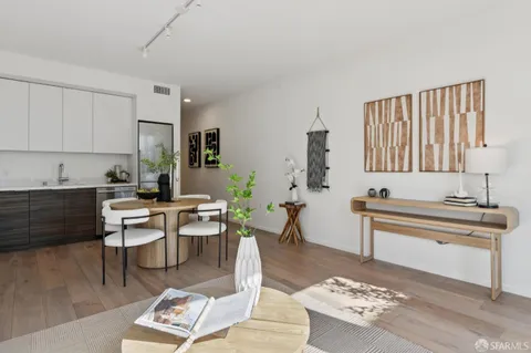 a living room with furniture and a rug