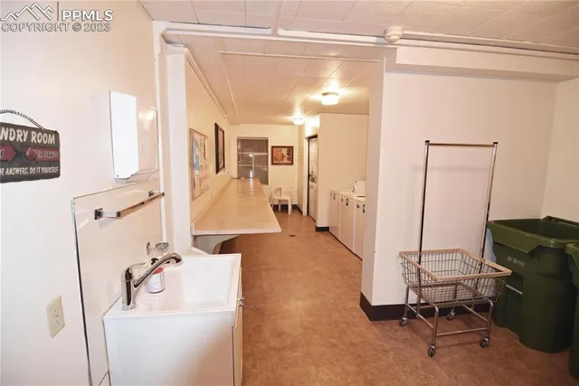 a bathroom with a sink a mirror and shower