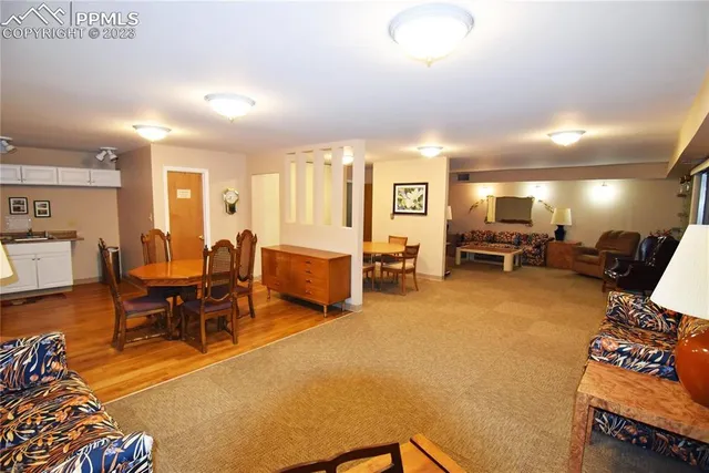 a living room with furniture and a table