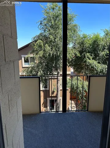 a view of a car park in front of a building