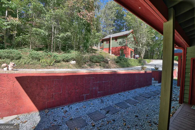 a kitchen with stainless steel appliances granite countertop a stove a sink dishwasher and a refrigerator with wooden floor