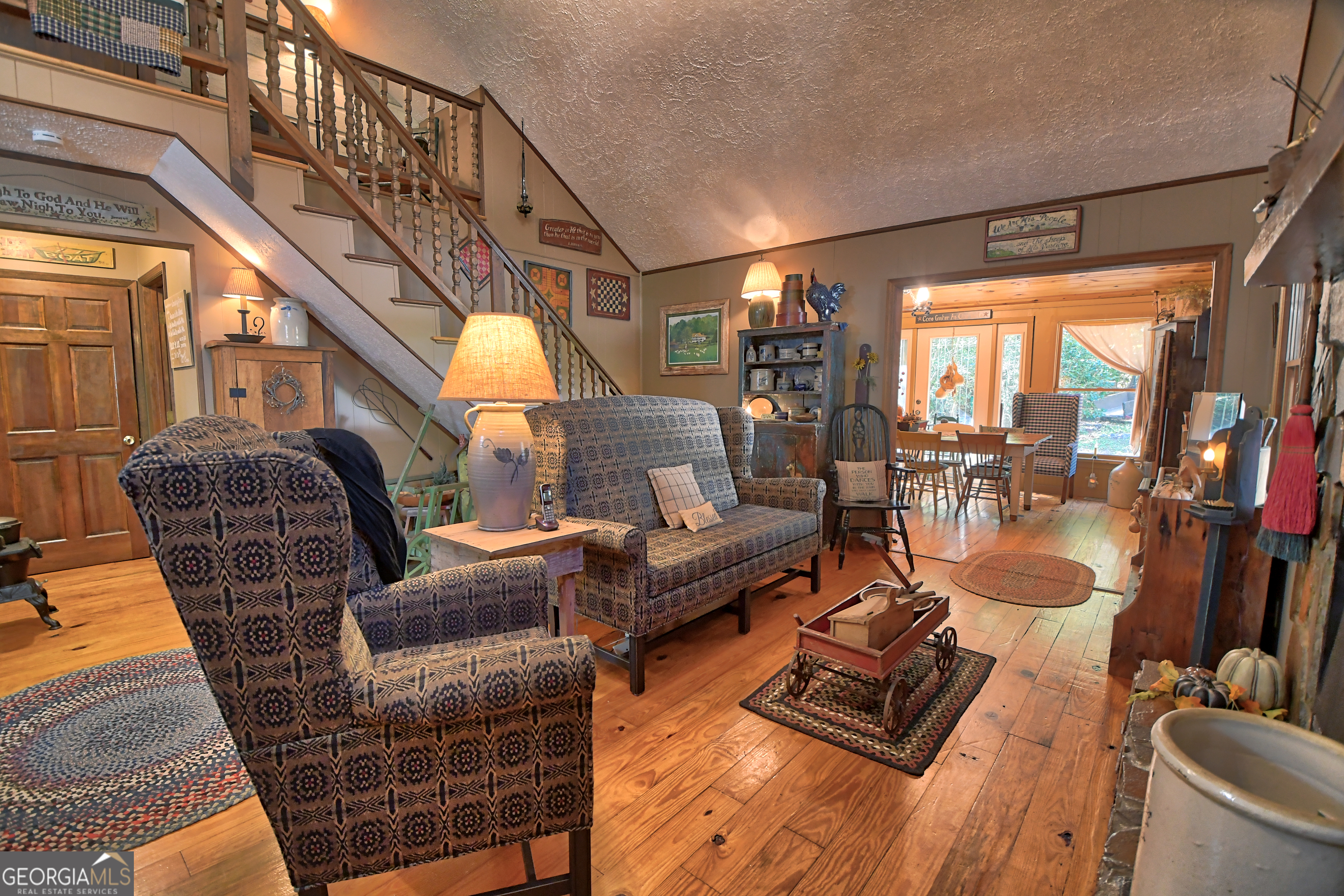 31 Creekside Lane Clayton, GA 30525 - Photo 3 of 65 a living room with furniture and a chandelier