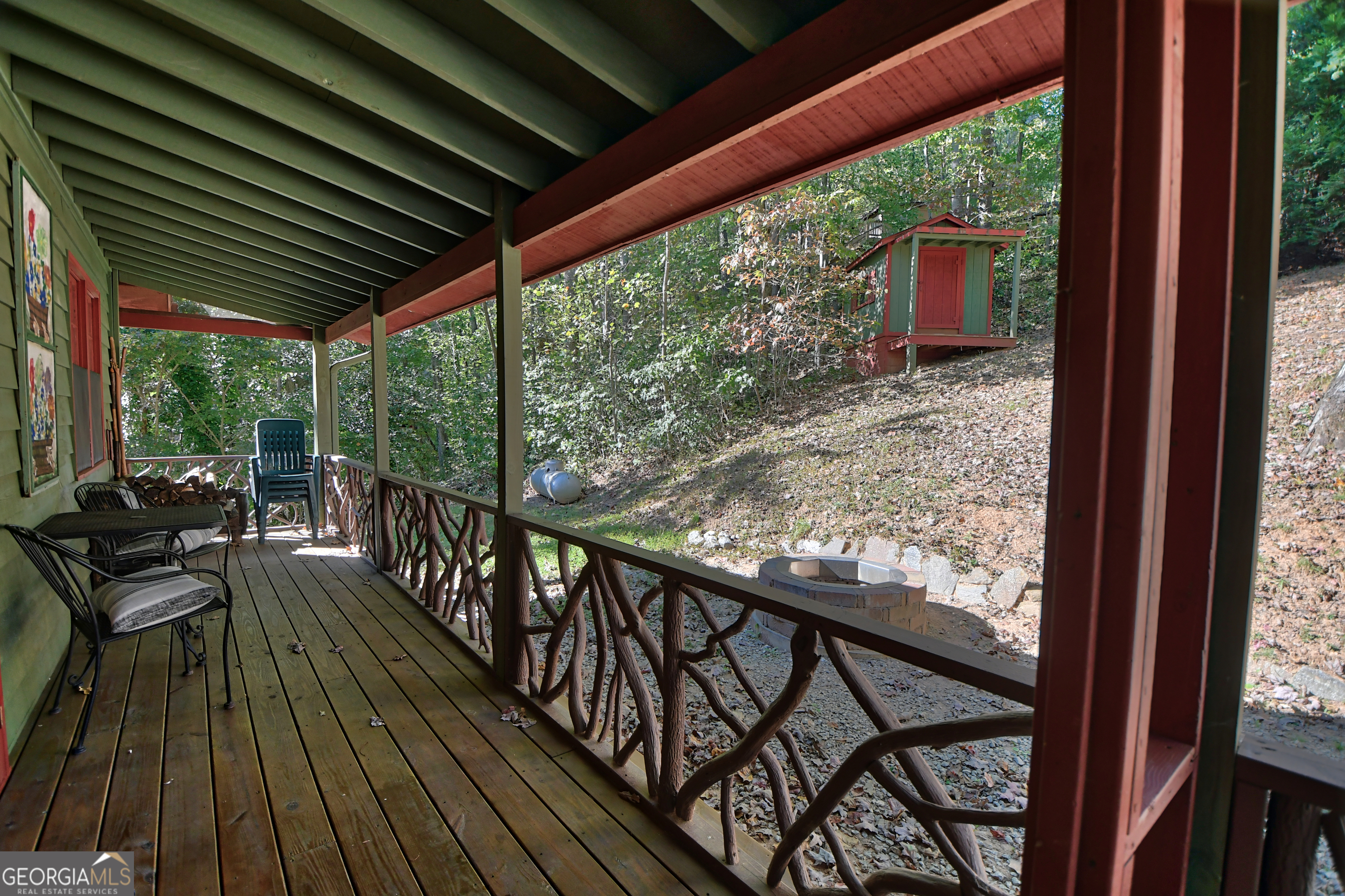 31 Creekside Lane Clayton, GA 30525 - Photo 36 of 65 a view of balcony with chairs and wooden floor