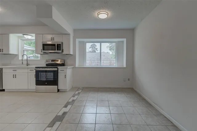 a bathroom with a sink and a window
