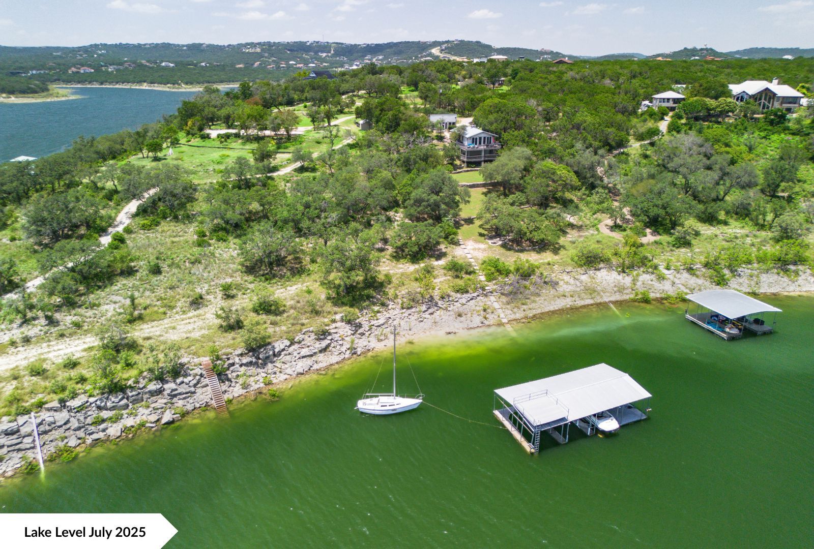 8007 Sharon Road Volente, TX 78641 - Photo 25 of 33 a view of a lake with houses