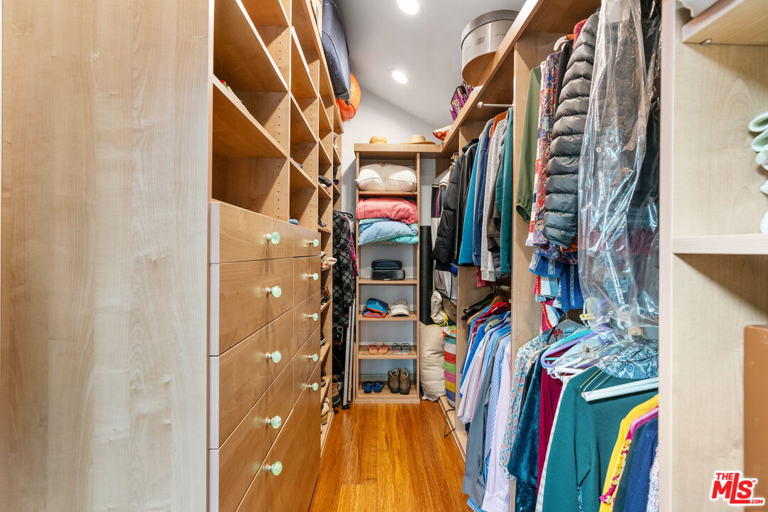 447 Sycamore Road Santa Monica, CA 90402 - Photo 17 of 36 a view of walk in closet with clothes and shoes