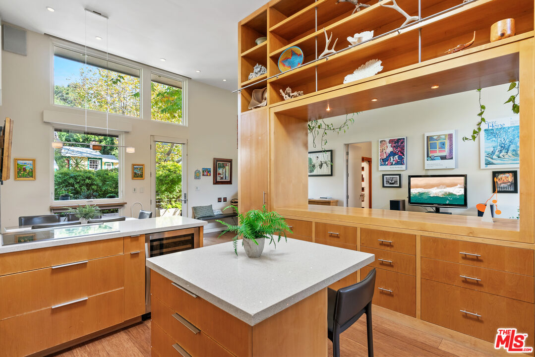 447 Sycamore Road Santa Monica, CA 90402 - Photo 18 of 36 a kitchen with stainless steel appliances a stove a sink and a refrigerator