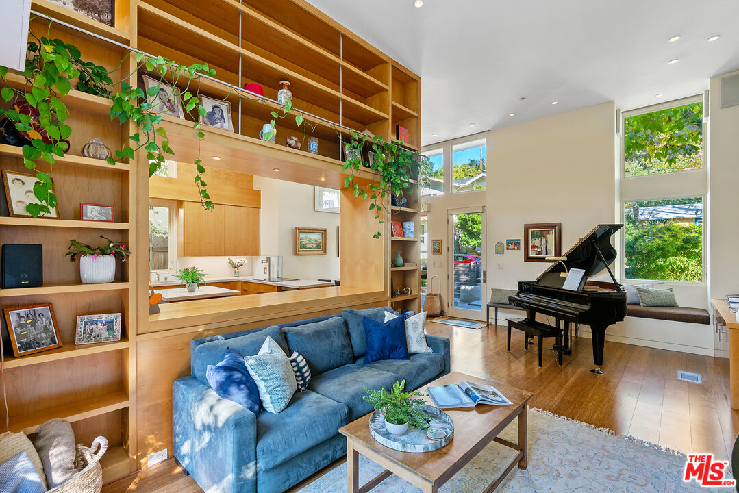 447 Sycamore Road Santa Monica, CA 90402 - Photo 20 of 36 a living room with furniture and a large window