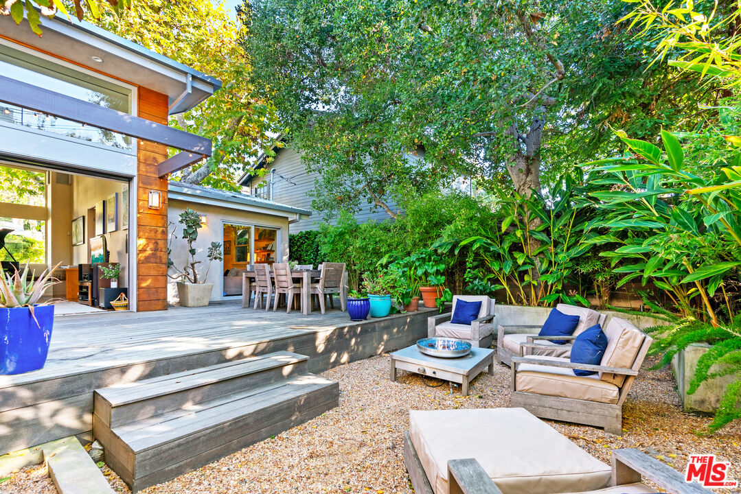 447 Sycamore Road Santa Monica, CA 90402 - Photo 30 of 36 a backyard of a house with outdoor seating