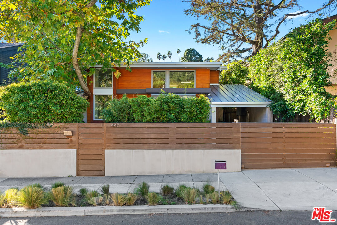447 Sycamore Road Santa Monica, CA 90402 - Photo 3 of 36 a front view of house with a garden