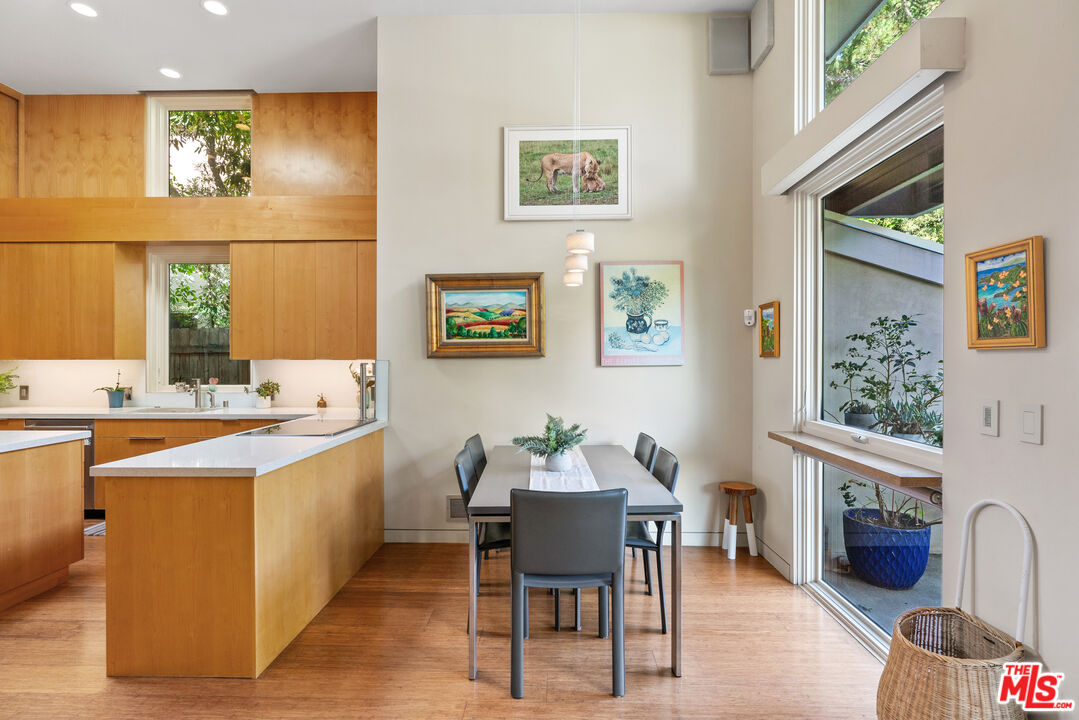 447 Sycamore Road Santa Monica, CA 90402 - Photo 4 of 36 a view of a dining room with furniture window and wooden floor
