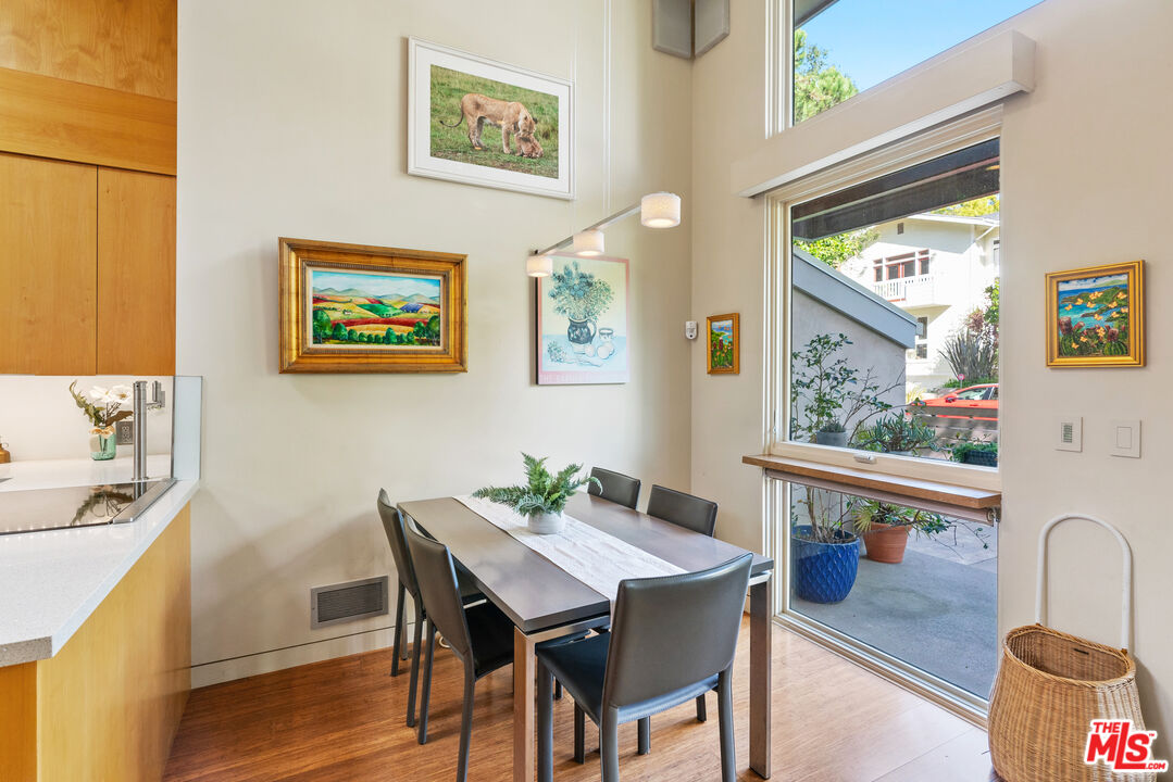 447 Sycamore Road Santa Monica, CA 90402 - Photo 5 of 36 a view of a dining room with furniture window and wooden floor