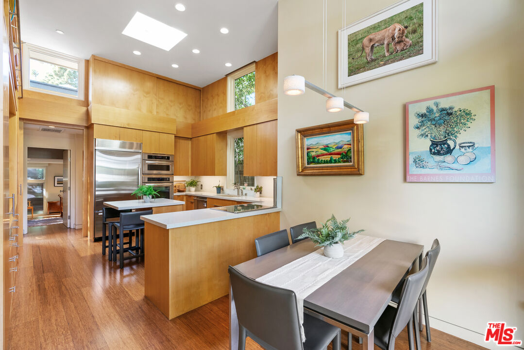 447 Sycamore Road Santa Monica, CA 90402 - Photo 6 of 36 a kitchen with a table and chairs in it